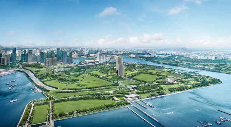 One Marina Gardens, artist&rsquo;s impression: an aerial view over the Marina South peninsula, with the towers among the green of Gardens by the Bay and the city skyline across the water